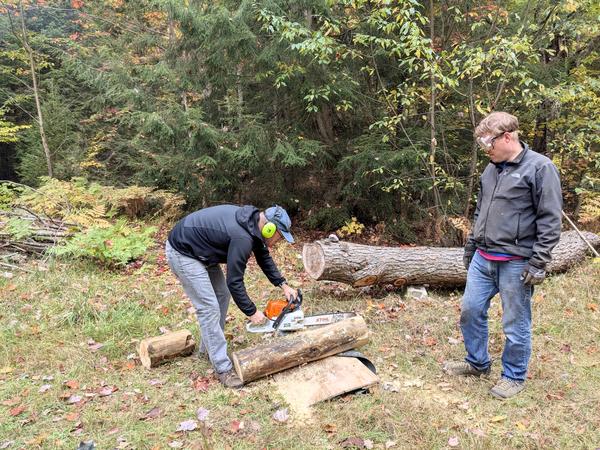 Andy preparing a patch for the sill log with Bill watching on.