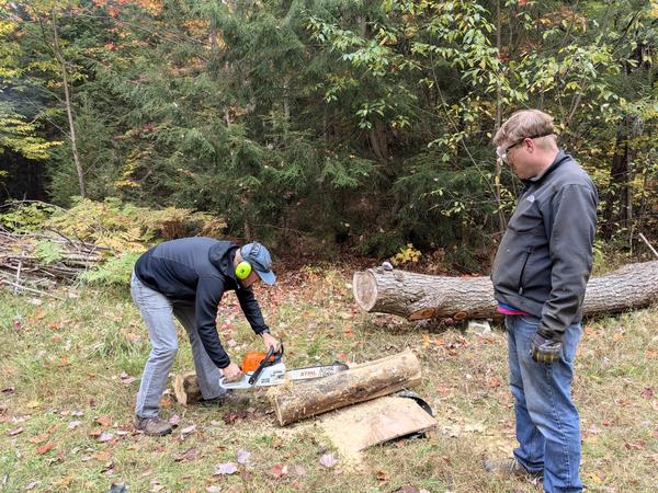 Andy preparing a patch for the sill log with Bill watching on.