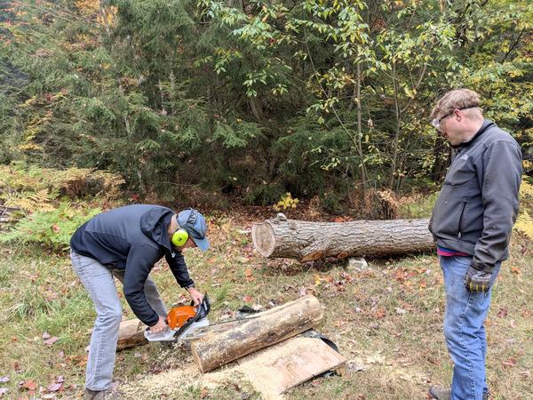 Andy preparing a patch for the sill log with Bill watching on.