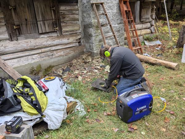 Bill prepping the chimney top attachment for the flue pipe.