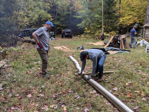 Mikey and Jim flattening the flue pipe.