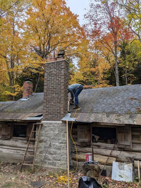 Mikey cutting out the location for the roof saddle.
