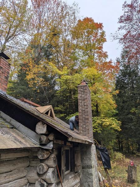 Mikey cleaning up the area for the new roof saddle.