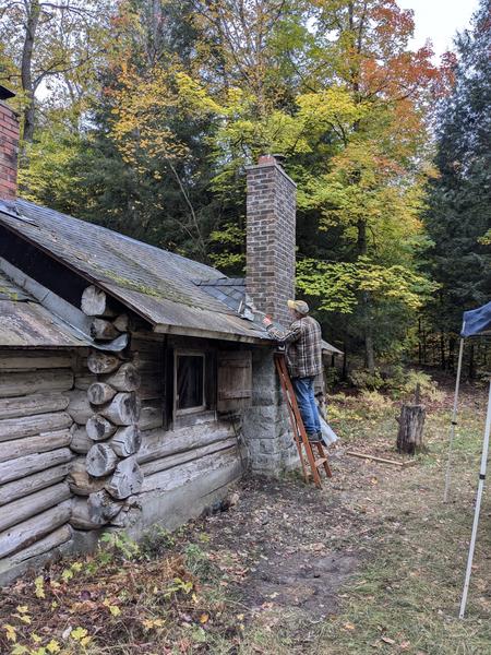 Bill putting final caulking around the chimney.