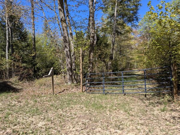 Gate off Old Seney somewhat blocking access to camp on Mitchell Lake.