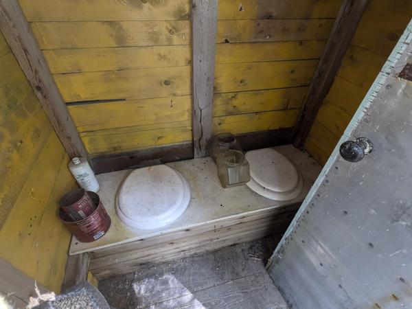 Inside of the outhouse at the ruined camp off McCloud Grade: a two seater!