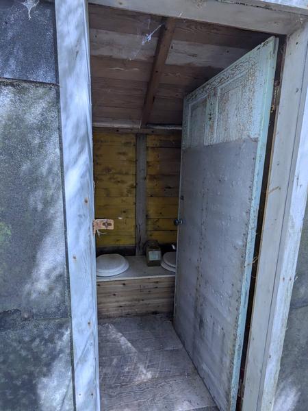 Inside of the outhouse at the ruined camp off McCloud Grade: a two seater!